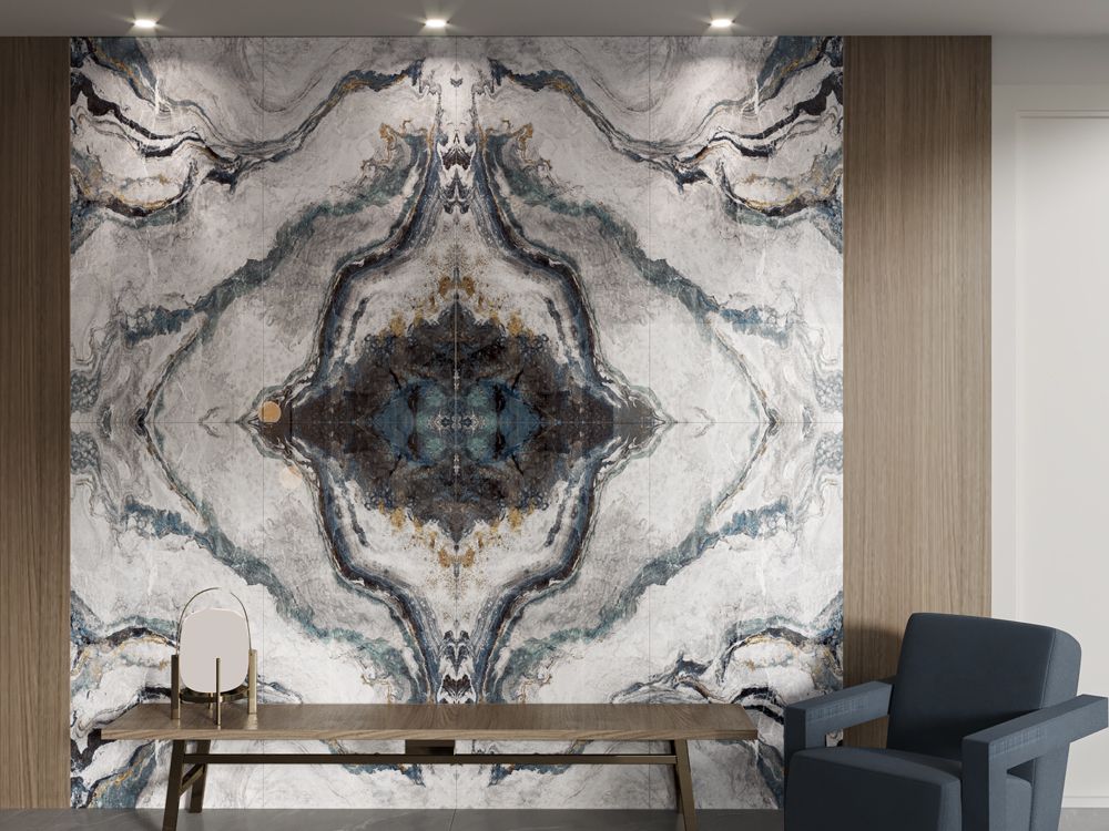 Sukha Bookmatch porcelain feature tile.Modern interior with a marble-patterned wall and a chair. Vivido Tiles